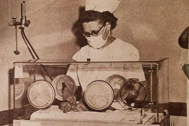 Shaffer as a nurse checking on a premature baby